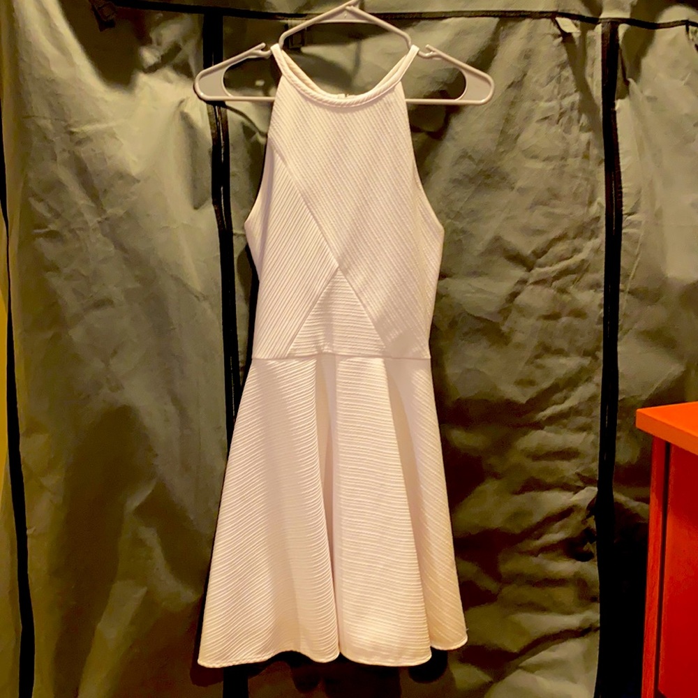Really cute dress for a teenager. Only worn once for graduation.